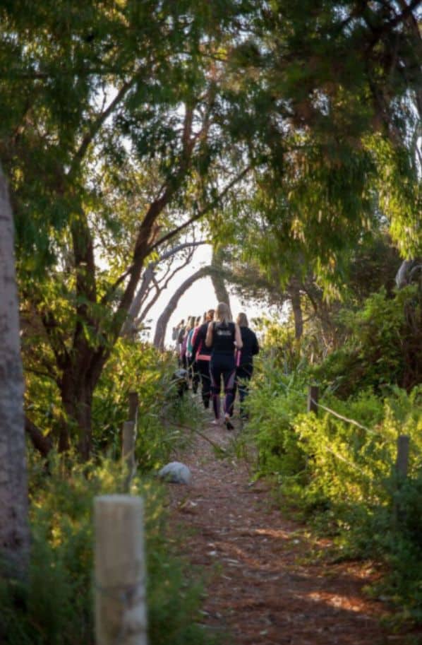 girls running in forest