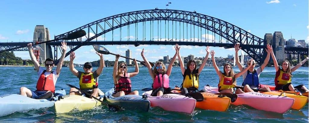 Sydney harbour bridge girls and guys on kayaks