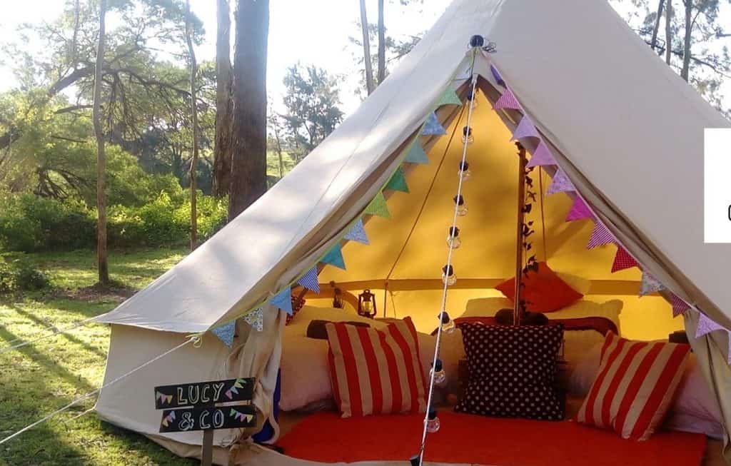 pitched tent with pillows