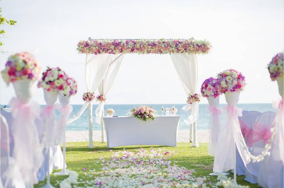 flower archway beach wedding free photo on pixab