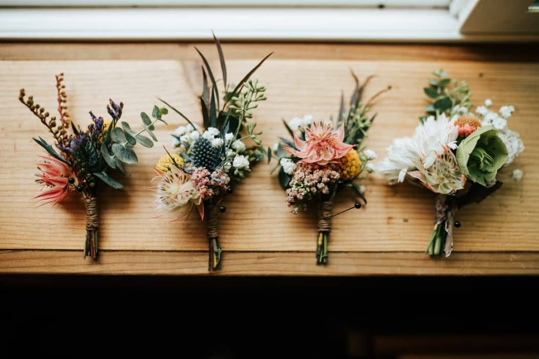 three flower bouquets on table photo – free weddin